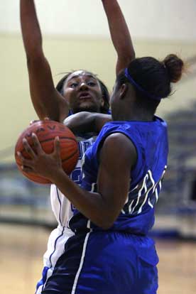 Dezerea Duckworth, left, defends against a Conway player during Tuesday's game. (Photo by Rick Nation)