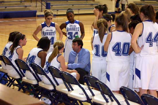 Bryant Lady Hornets freshman coach Nathan Castaldi instructs his team during a timeout in Tuesday's game. (Photo by Rick Nation)