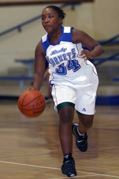 Destin Nichols brings the ball up the floor. (Photo by Rick Nation)