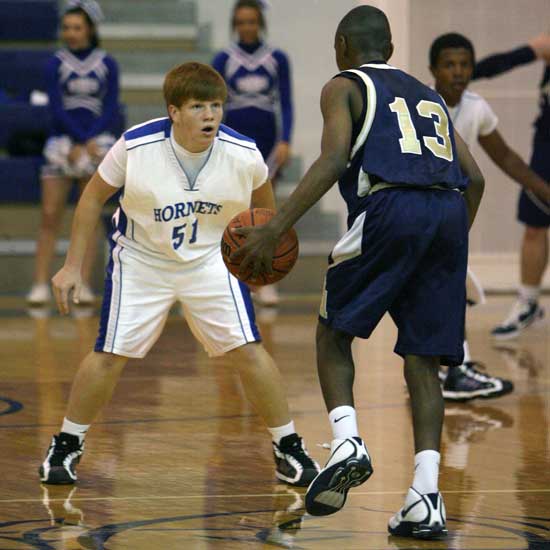 Bryant's Gray Orman (51) defends against the Pulaski Academy ball-handler during Tuesday's game. (Photo by Rick Nation)