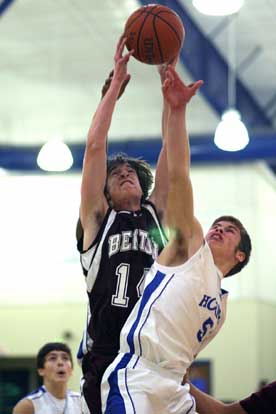 Bryant's Davis Nossaman, right, fights for a rebound. (Photo by Rick Nation)