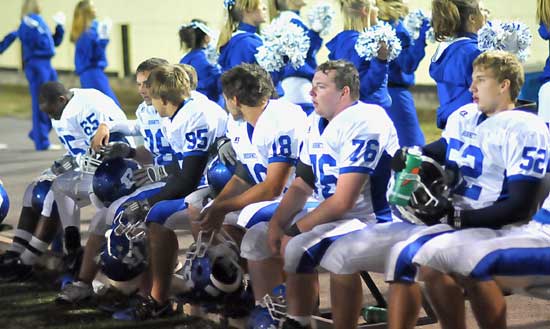 Bryant defenders Cortez Williams (65), Michael Smith (95), Hunter Mayall (18), Matt Jones (76) and Ben Seale (52) rest on the bench. (Photo by Kevin Nagle)