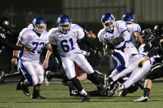 Justin Rausch (73), Cordell Boykins (61) lead Karon Dismuke (5). (photo by Rick Nation)