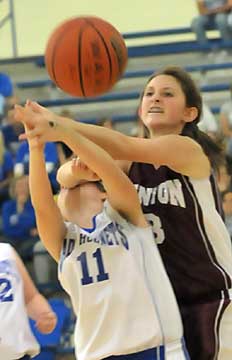 Things got a little rough at times for the Lady Hornets including Isabella Bluemmel (11). (Photo by Kevin Nagle)