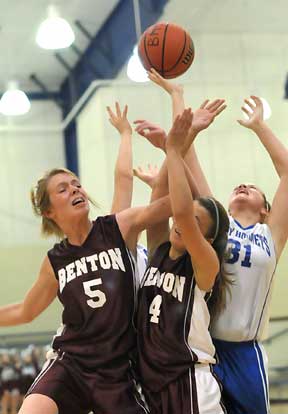 Bryant's Rylee Phillips (31) battles a pair of Benton players for a rebound. (Photo by Kevin Nagle)
