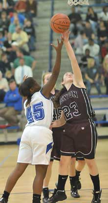 Bryant's Kaitlyn Greer (45) tries to shoot over Benton's Savanna Mayo. (Photo by Kevin Nagle)