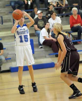 Rori Whittaker (15) launches a jumper. (Photo by Kevin Nagle)