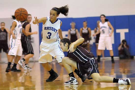 Bryant's McKenzie Adams (3) swipes the ball from Benton's Akane Forbess. (Photo by Kevin Nagle)