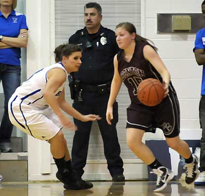 Bryant's Callie Hogancamp, left, applies defensive pressure on Benton's Brooke Million. (Photo by Kevin Nagle)