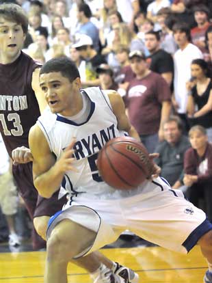 Bryant's Jordan Griffin (5) drives around Benton's Nick Garner. (Photo by Kevin Nagle)