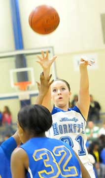 Jessica Alliston takes a shot over a pair of North Little Rock defenders. (Photo by Kevin Nagle)