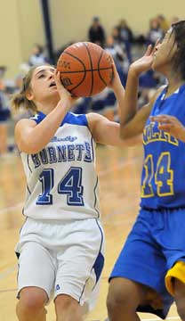 Bryant's Caylin Choate, left, looks hoopward. (Photo by Kevin Nagle)