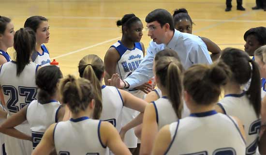 Bryant freshman girls coach Nathan Castaldi instructs his team during a timeout Thursday night. (Photo by Kevin Nagle)
