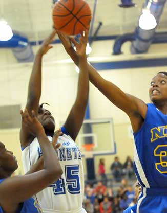 Kaitlyn Greer (45) battles for a rebound. (Photo by Kevin Nagle)