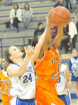 Colleen Johnson (24) reaches for rebound. (Photo by Kevin Nagle)