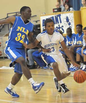 Bryant's C.J. Rainey (23) is hounded by a North Little Rock defender. (Photo by Kevin Nagle)