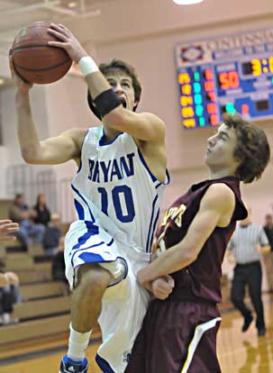 Bryant's Brantley Cozart goes up for a shot around Lake Hamilton's Blake Tilley. (Photo by Kevin Nagle)