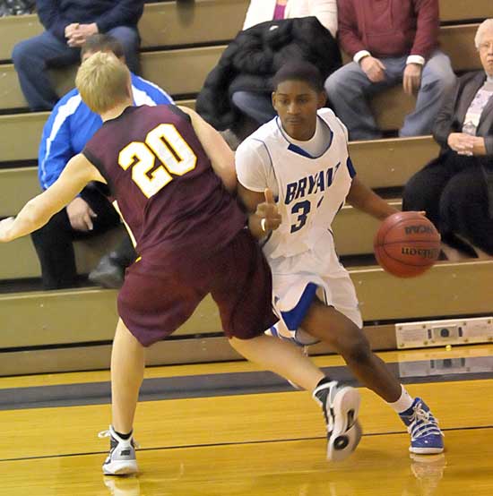 Bryant sophomore Leon Neale (33) looks for room on the baseline to get past Lake Hamilton's Roy Hurst. (Photo by Kevin Nagle)