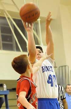 Bryant's Zach Jackson puts up a shot. (Photo by Kevin Nagle)