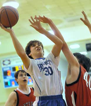 Bryant White's Austin Masters (30) launches a shot of Anthony School defenders. (Photo by Kevin Nagle)
