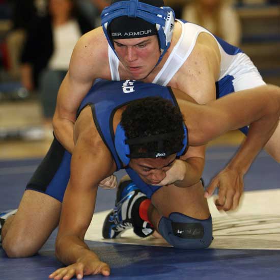 Bryant's Hunter Schelle gains the advantage of a competing wrestler.(Photo by Rick Nation)