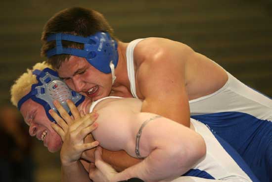 Bryant's Odell Lee works to get out of a hold of teammate Michael "Blue" Smith during Thursday's high school wrestling exhibition at the Bryant Middle School gym. (Photo by Rick Nation)