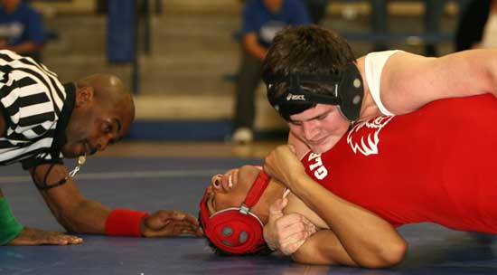 Bryant's Levi Brady tries to get a pin on a Glen Rose wrestler. (Photo by Rick Nation)