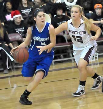 Bryant's London Abernathy (5) drives around Benton's Korie Parker. (Photo by Kevin Nagle)