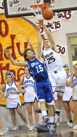 Bryant's Houston Garner, left, and Benton's Luke Vance battle for a loose ball. (Photo by Kevin Nagle)