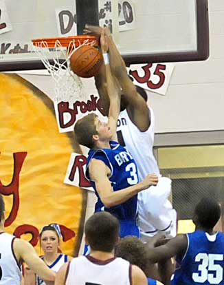 Bryant's Quinton Motto, left, spoils an alley-oop pass for a dunk by Eddie Poland. (Photo by Kevin Nagle)