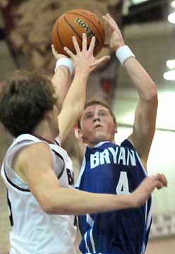 Kyle Nossaman shoots over a Benton defender. (Photo by Kevin Nagle)