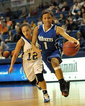 Bryant's Kiara Moore (1) drives past Lakeside's Keia Allen. (Photo by Kevin Nagle)