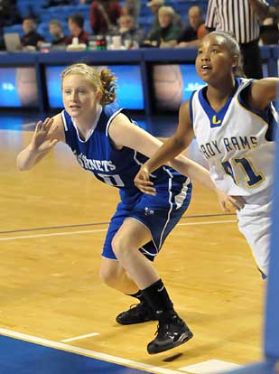 Bryant's Kristen Scarlett (10) and Lakeside's Andrea Stuart (41) start after a rebound. (Photo by Kevin Nagle)