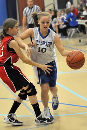 Annamarie Blair tries to drive around a Cabot North defender. (Photo by Kevin Nagle)