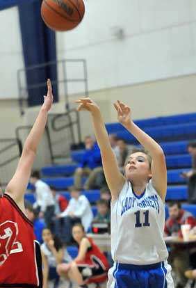 Bella Bluemmel (11) hit a 3-pointer at the buzzer to send Tuesday's eighth grade game into overtime. (Photo by Kevin Nagle)