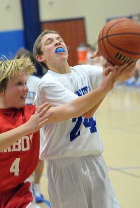 Jordan Gentry (24) battles for possession of the ball. (Photo by Kevin Nagle)