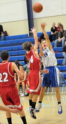 Jason Hastings (14) fires a shot from outside. (Photo by Kevin Nagle)