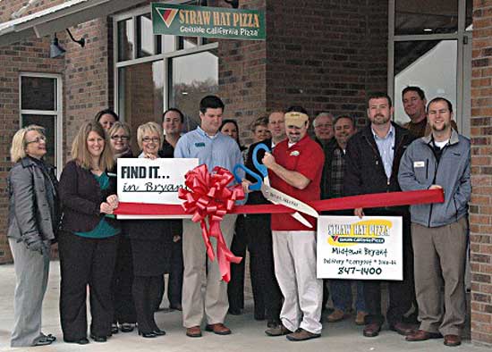 Members of the Bryant Chamber of Commerce hosted a ribbon-cutting ceremony Thursday at Straw Hat Pizza. (Photo by Martin Couch)