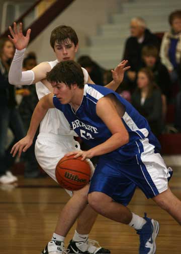 Bryant's Zach Cambron, right, drives around a Benton defender during Thursday's game. (Photo by Rick Nation)