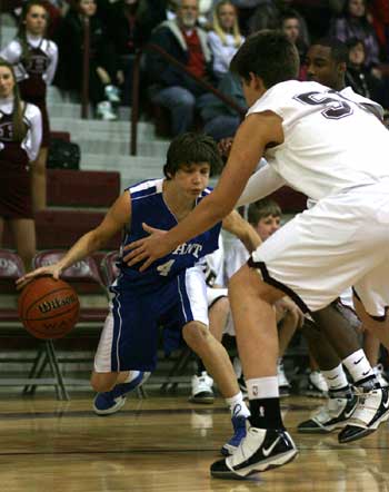 Bryant's Luke Rayburn looks for room to drive around Benton's Graham Gardner. (Photo by Rick Nation)