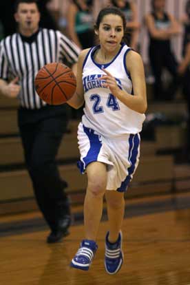 Reagan Barker brings the ball up the court during Saturday's game. (Photo by Rick Nation)