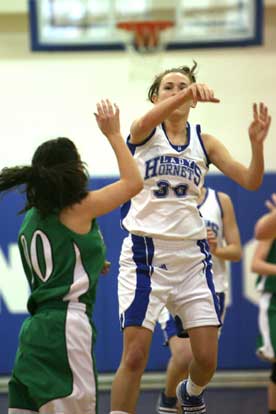 Bryant's Casey Lee throws in a 3 from midcourt at the end of Saturday's game. (Photo by Rick Nation)