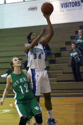 Alana Morris goes up for a layup in front of Van Buren's Kirbey Blake. (Photo by Rick Nation)