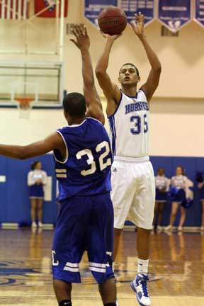 Dontay Renuard shoots over Conway's Kenyon McNeaill. (Photo by Rick Nation)