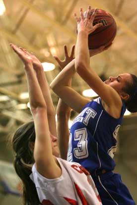 McKenzie Adams goes up over Cabot's Abbey Allgood for 2 of her 21 points.