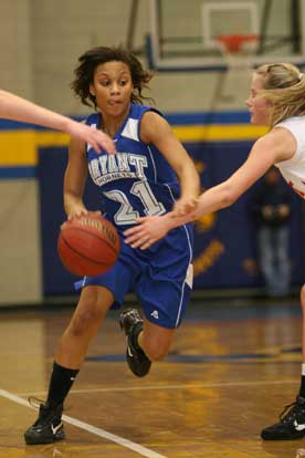 Bryant's Kiara Moore drives between two Cabot South defenders. (Photo by Rick Nation)