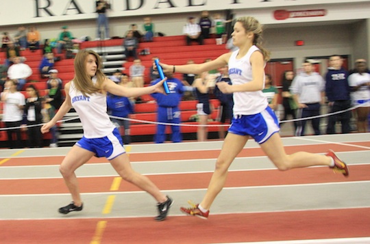 Andrea Savage hands off the baton to Lauren Stiles in the 4 x 400 relay. (Photo courtesy of Carla Thomas)