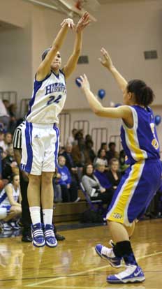 Bryant's Hannah Goshien shoots a 3 over North Little Rock's Markeisha Hawkins. (Photo by Rick Nation)
