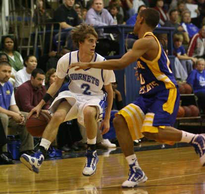 Brandon Parish (2) looks upcourt while being guarded by North Little Rock's Brandon Tyler. (Photo by Rick Nation)