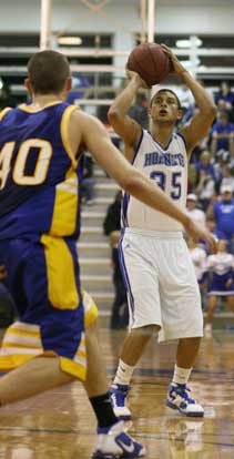 Dontay Renuard launches a 3. (Photo by Rick Nation)